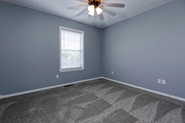 unfurnished room with carpet flooring, ceiling fan, and a textured ceiling