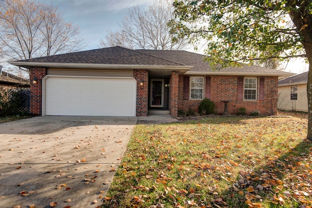 ranch-style home featuring a front yard and a garage