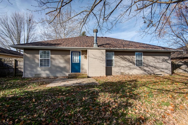 back of house featuring a patio and a lawn