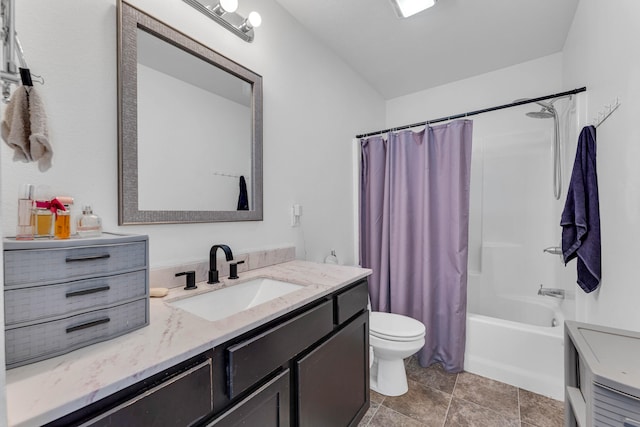 full bathroom featuring tile patterned flooring, vanity, toilet, and shower / tub combo