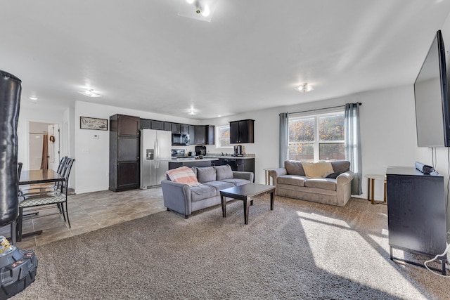 living room featuring light carpet