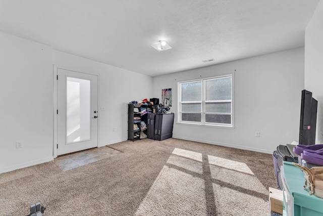 misc room featuring light colored carpet