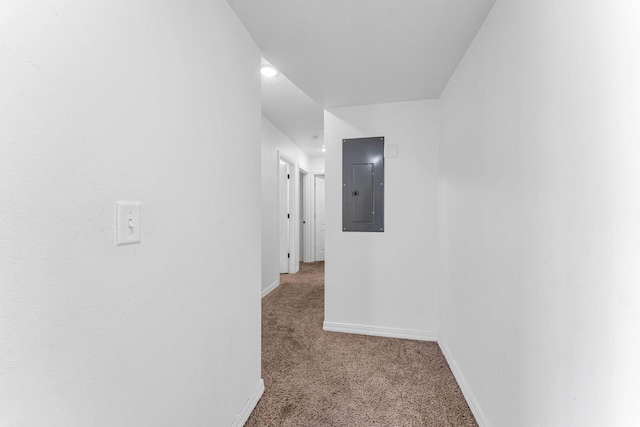 hallway with carpet flooring and electric panel