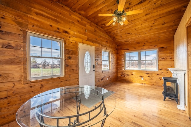 dining room with a wealth of natural light, wooden ceiling, lofted ceiling, and light wood-type flooring