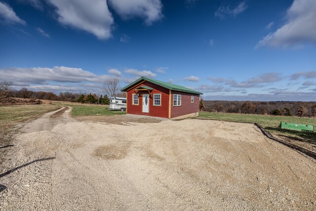 view of home's exterior with an outdoor structure