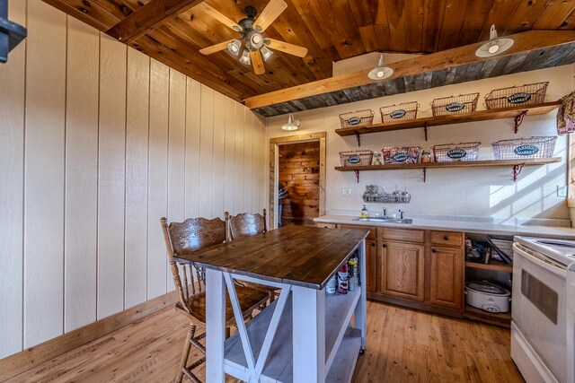 kitchen featuring wood ceiling, light wood-type flooring, vaulted ceiling, and white electric stove