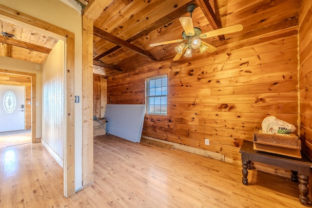 additional living space with wood walls, plenty of natural light, light hardwood / wood-style floors, and wooden ceiling