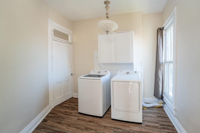 laundry area with dark hardwood / wood-style floors and independent washer and dryer