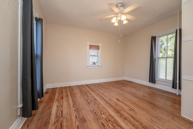 empty room featuring ceiling fan and light hardwood / wood-style flooring