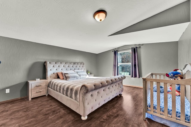 bedroom featuring dark hardwood / wood-style floors and vaulted ceiling