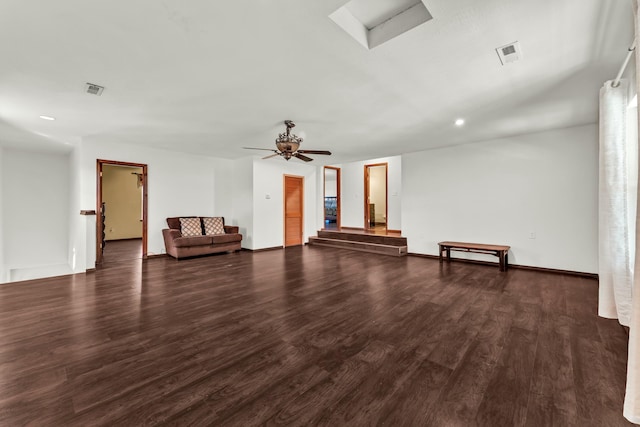 unfurnished living room with ceiling fan and dark wood-type flooring