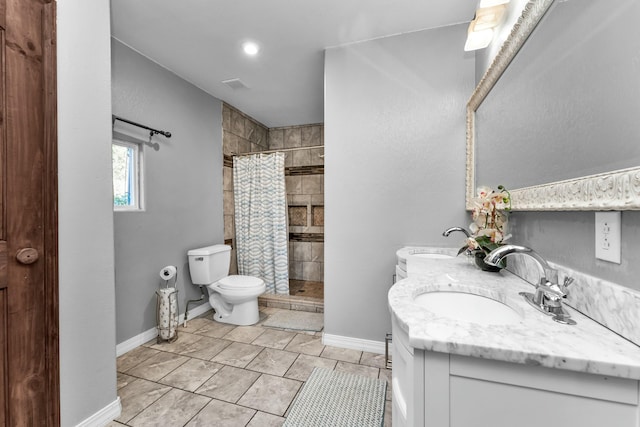 bathroom with tile patterned floors, walk in shower, vanity, and toilet