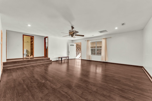 empty room with ceiling fan and dark hardwood / wood-style floors