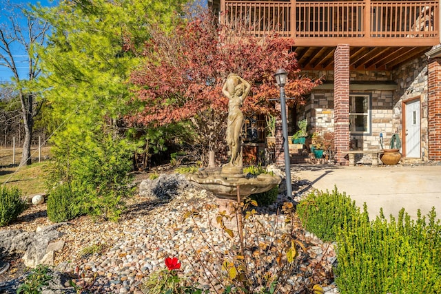 view of yard with a deck and a patio