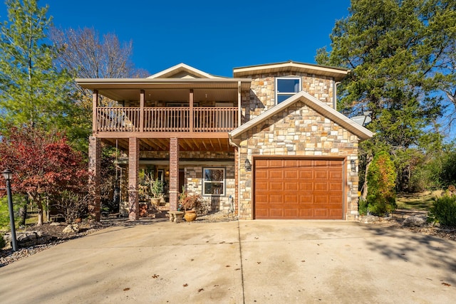 view of front property with a garage and a balcony