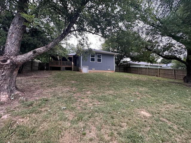 view of yard featuring a wooden deck