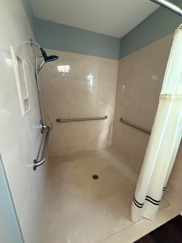 bathroom with a shower with shower curtain