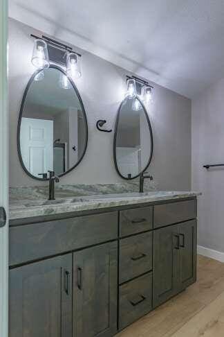 bathroom featuring vanity and hardwood / wood-style floors