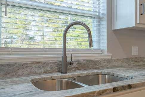 details featuring sink and white cabinets