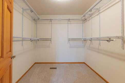 spacious closet featuring carpet floors