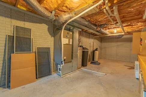 unfinished basement with water heater