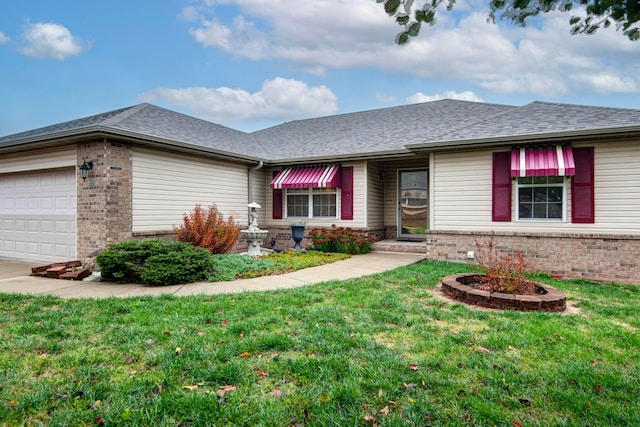 ranch-style home featuring a garage and a front lawn