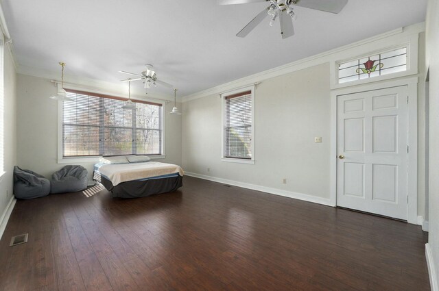 unfurnished bedroom featuring ceiling fan, dark hardwood / wood-style flooring, and ornamental molding