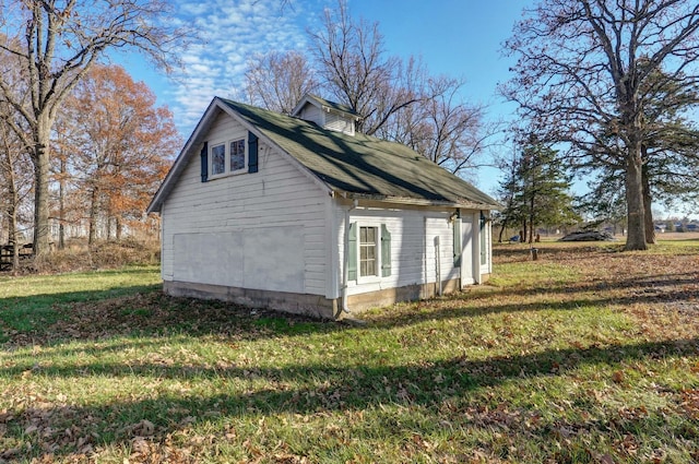 view of home's exterior with a lawn