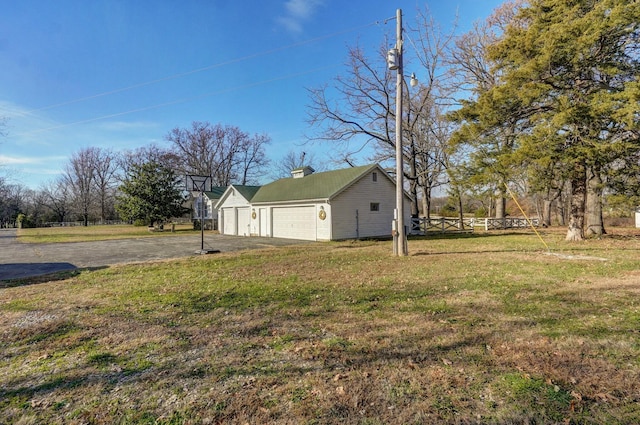 view of yard with a garage