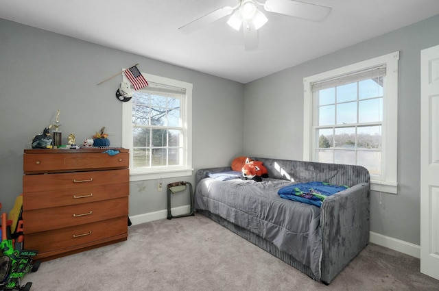 bedroom with ceiling fan and light colored carpet