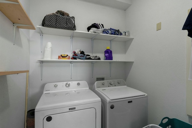 laundry area with independent washer and dryer