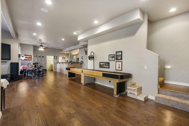 playroom featuring ceiling fan and dark hardwood / wood-style flooring