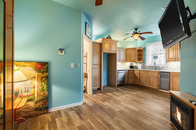 kitchen with decorative backsplash, hardwood / wood-style flooring, dishwasher, and ceiling fan