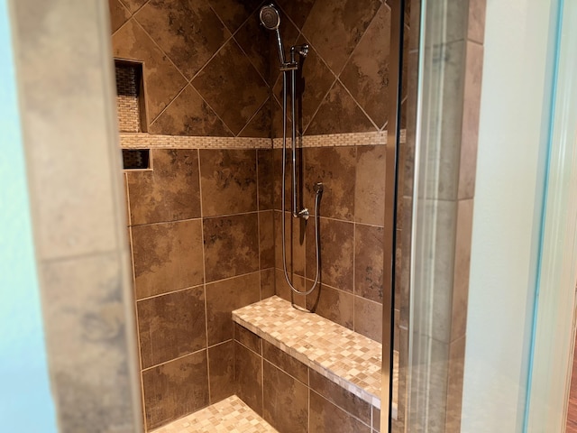 interior space featuring a tile shower