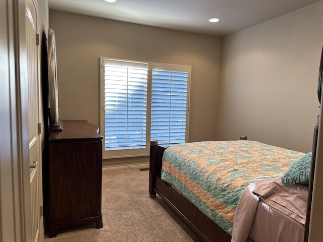 carpeted bedroom with multiple windows