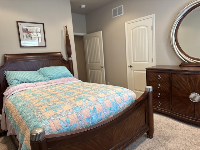 bedroom featuring light carpet