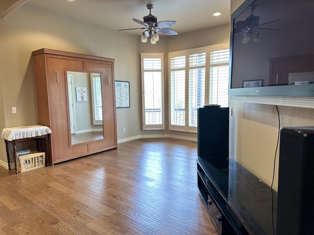 interior space featuring ceiling fan and hardwood / wood-style floors