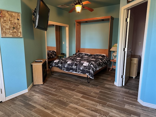 bedroom featuring ceiling fan and dark wood-type flooring