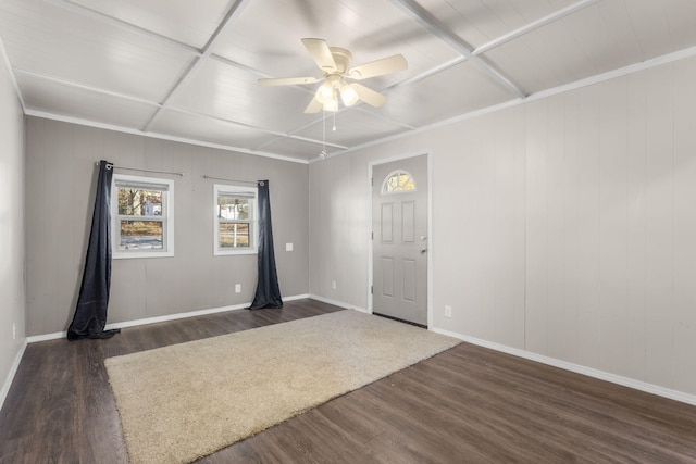 spare room with dark wood-type flooring and ceiling fan