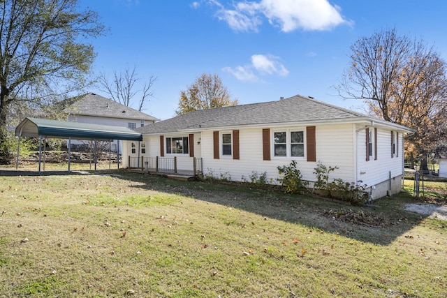 ranch-style home with a carport and a front lawn