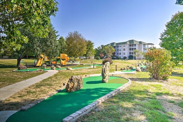 570 Abby Ln Unit 3, Branson, MO 65616 - surrounding community with a putting green and a lawn