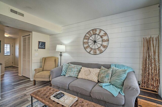 570 Abby Ln Unit 3, Branson, MO 65616 - living room featuring wood finished floors, wood walls, and baseboards