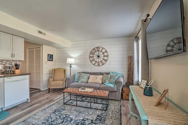 570 Abby Ln Unit 3, Branson, MO 65616 - living room featuring light wood-style floors and wood walls