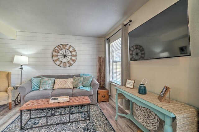 570 Abby Ln Unit 3, Branson, MO 65616 - living room with wood finished floors, wooden walls, and baseboards