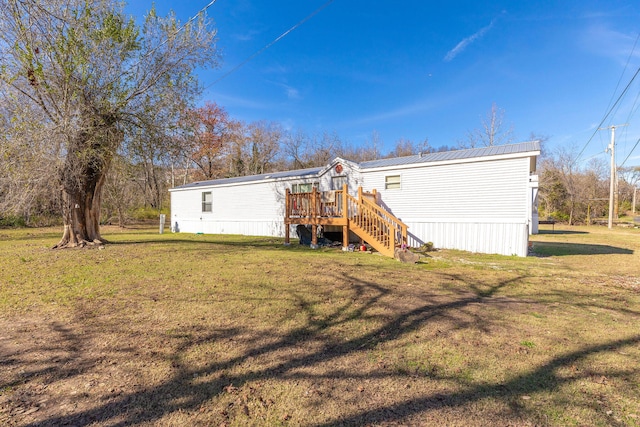 back of house with a yard