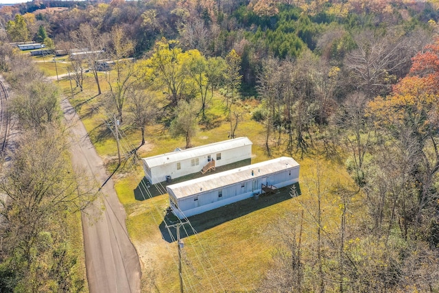 view from above of property featuring a heavily wooded area