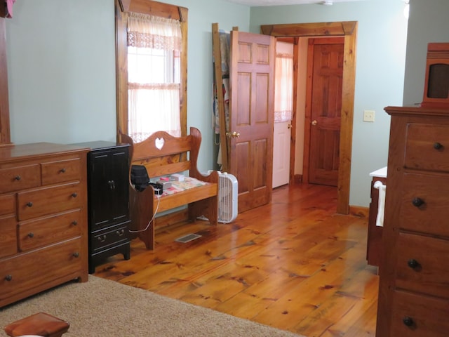 bedroom featuring hardwood / wood-style flooring