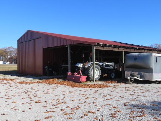 view of outbuilding with a carport