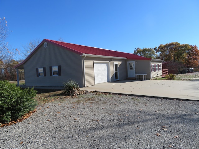 view of side of home with a garage