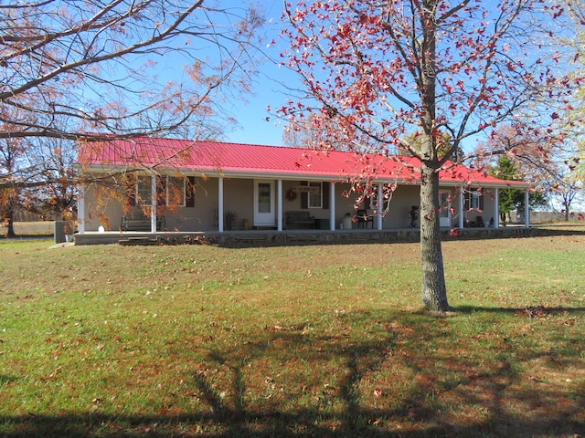 rear view of house with a lawn